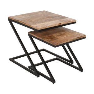 May include: Two-piece nesting table set. The tables have a light brown, rectangular wooden top and a black metal Z-shaped frame. The top table is slightly larger than the bottom table. The tables are designed to nest together.