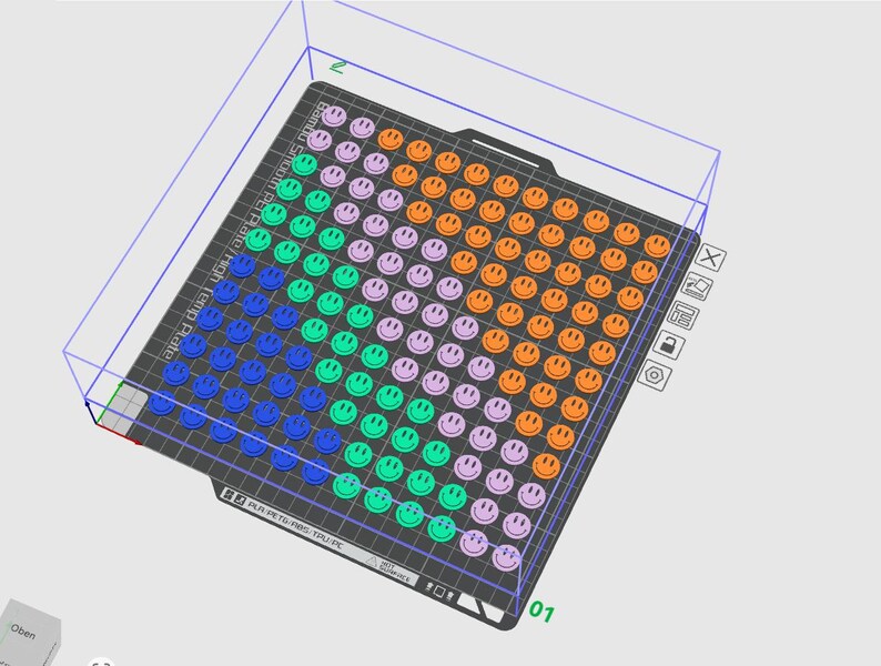 May include: A black rectangular plate covered in a grid of smiley faces in various colours: blue, green, purple, and orange. The plate has the text "Bambu Smooth PEI High Temp Plate". The smiley faces are arranged in rows and columns.