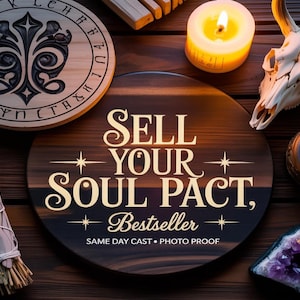 May include: A dark brown wooden sign with the text "SELL YOUR SOUL PACT, Bestseller" is surrounded by a lit candle, a skull, a bundle of sage, and an amethyst crystal. The sign has gold lettering.