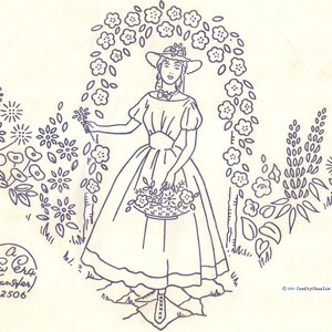 May include: A black and white embroidery pattern of a woman in a dress holding a basket of flowers. The woman is standing under a floral archway. The pattern is labeled "A New Era Transfer N&deg;2506".