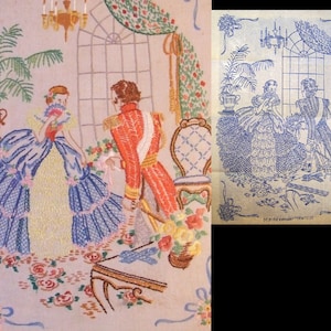 May include: A vintage needlepoint embroidery depicting a couple in a room with a window, a chandelier, and a potted plant. The woman is wearing a blue and yellow dress, and the man is wearing a red coat. The embroidery is framed with a blue border and includes the text "DESIGN COPYRIGHT "YVONNES".