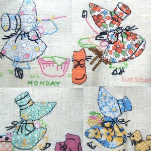 May include: A vintage embroidered kitchen towel featuring four different scenes of a woman in a dress and hat. Each scene is labelled with a day of the week: Monday, Tuesday, Wednesday, and Thursday. The towel is white with a linen texture.