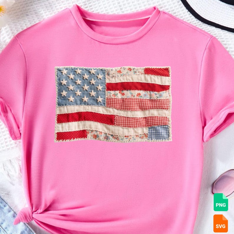May include: A pink t-shirt featuring a patchwork American flag design. The flag includes a blue denim field with white stars, red and white striped sections, and floral and gingham patterns.