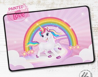 "Unicorn" desk mat in front of the rainbow gate, glitter, friendly design for children, pink magical world, cartoon unicorn magic