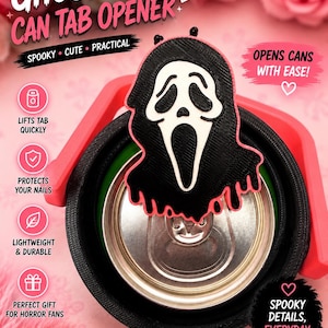 May include: A black and white Ghost Face can tab opener with a red handle. The opener is designed to lift tabs quickly and protect nails. Text on the opener says "Spooky, Cute, Practical" and "Scary Good for Every Can!"
