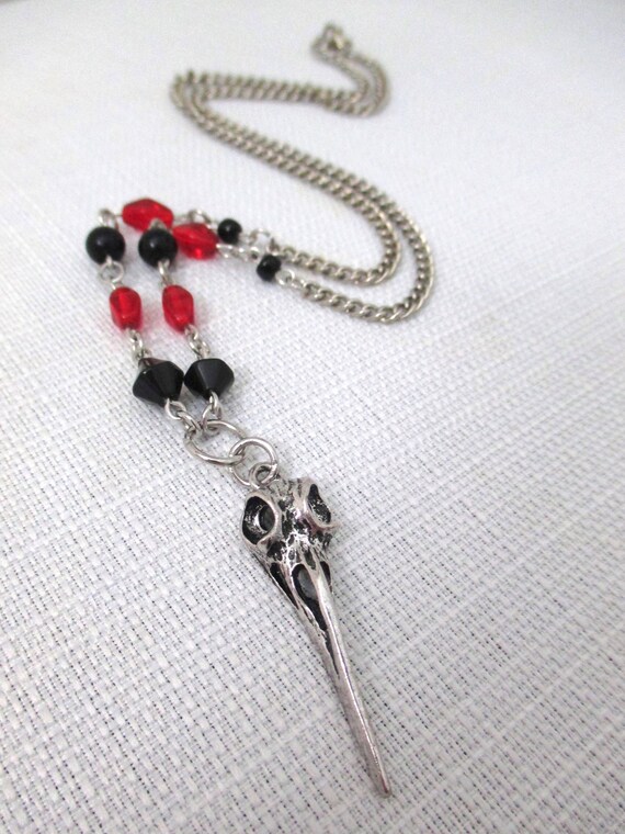 clear pendant with hand painted black and red rose charm Black and red beaded necklace black skulls
