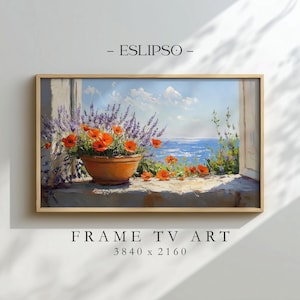 May include: A rectangular framed digital art piece labelled ESLIPSO and FRAME TV ART 3840 x 2160. The artwork depicts a terracotta pot filled with purple lavender and orange poppies sitting on a stone ledge overlooking a bright blue sea.