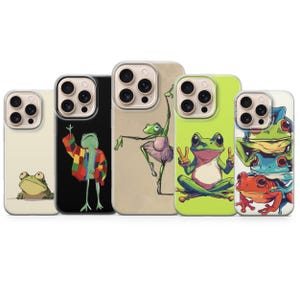 May include: A selection of phone cases with quirky frog designs. The cases showcase frogs in various poses, including one in a jacket, a ballet frog, and a frog giving the peace sign. The cases have a clear border and a range of background colours.