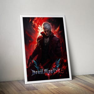 May include: Framed artwork featuring a character with white hair and a red coat, set against a fiery red background. The artwork is titled "Devil May Cry 5" in a stylized font with blue accents. The image is in a white frame.