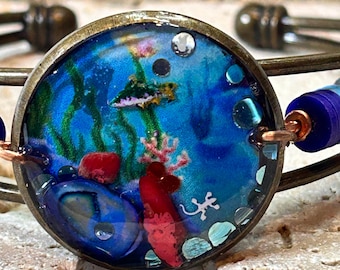 Pulsera de trucha con geco, Terrain, ajustable, con puño tejido de alambre.