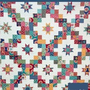 May include: Layer Cake Ladder Quilt Pattern by The Tipsy Needle. The finished quilt size is 50" x 70". The quilt features a colorful patchwork design with star and square patterns in various colors, including red, blue, and orange.