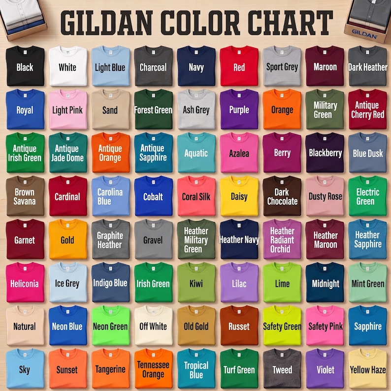May include: A Gildan color chart featuring a grid of folded t-shirts in various solid colors and heathered shades. Each shirt is labeled with its specific color name, including black, white, red, blue, green, and yellow tones, arranged in rows.