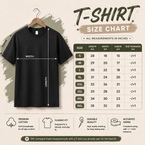 May include: A black short-sleeve t-shirt hanging on a wooden hanger next to a size chart with measurements in inches. The chart lists sizes from S to 5XL with corresponding length, width, and sleeve measurements, plus a size tolerance of -/+1 inch.