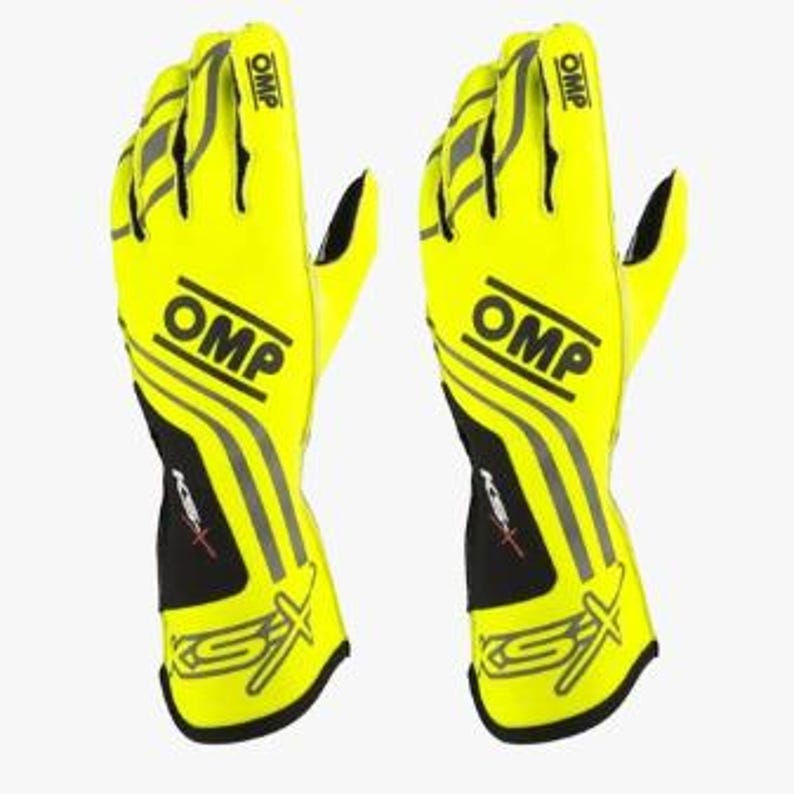 May include: Pair of bright yellow racing gloves with the OMP logo and gray accents. The gloves have black and gray details on the wrist and fingers. The gloves are designed for motorsports.