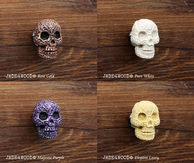 May include: Four decorative skull drawer pulls in different colors: rose gold, pure white, majestic purple, and elegant ivory. Each skull has intricate details and a floral design.