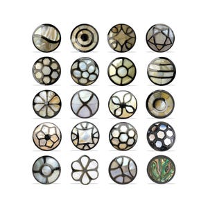 May include: Twenty decorative round buttons with inlaid designs. The buttons feature geometric shapes, floral motifs, and abstract designs, set within a dark border. Each button has a unique pattern, suitable for various craft projects.