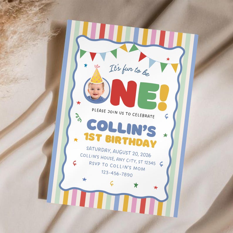 May include: A rectangular birthday invitation card featuring a colorful vertical striped border. The center displays the text 'It's fun to be ONE!', a photo of a baby in a party hat, and event details for Collin's 1st birthday on August 20, 2026.