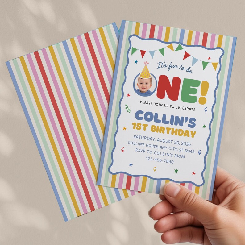 May include: A rectangular birthday invitation card featuring a colorful vertical striped pattern in red, yellow, blue, and green. The card displays a photo of a child in a party hat, the text It's fun to be ONE!, Collin's 1st Birthday, and event details.