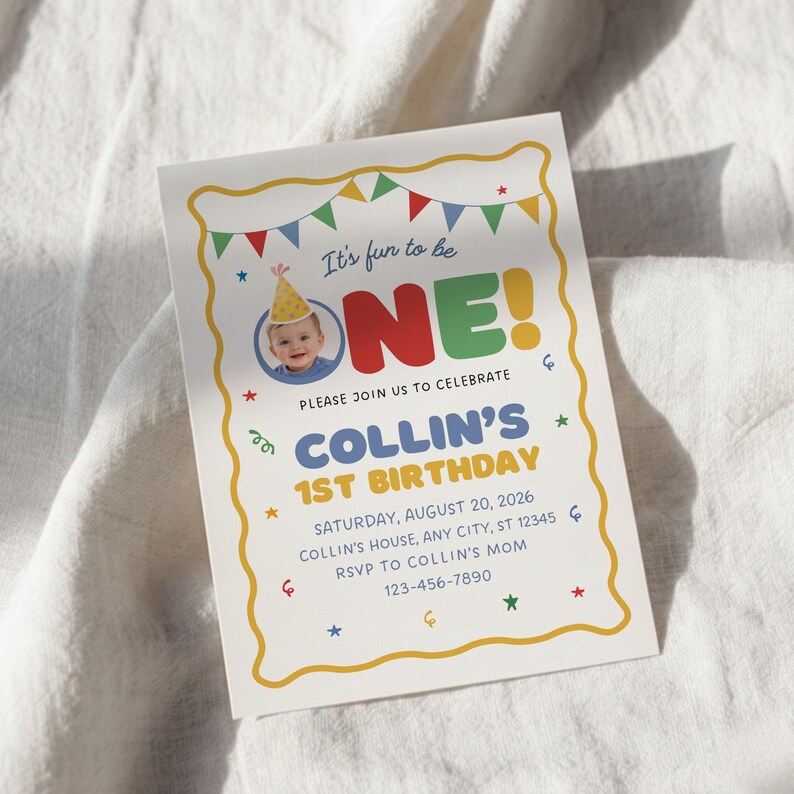 May include: A birthday invitation with a yellow border and colorful accents. The invitation reads "It's fun to be ONE!" with a photo of a baby wearing a party hat. The text includes the name "Collin's" and the date of the first birthday.