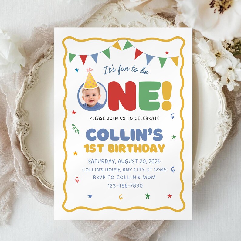 May include: A birthday invitation with a yellow border and colorful accents. The text reads "It's fun to be ONE!" with a photo of a baby. The invitation is for Collin's 1st birthday, with date, time, and RSVP information.