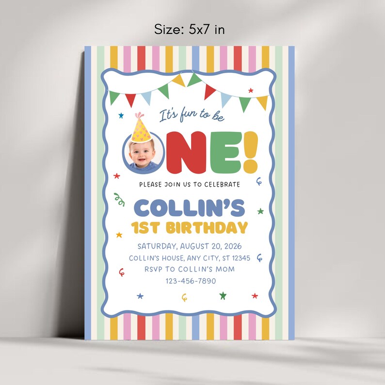 May include: A 5x7 inch birthday invitation card featuring a colorful striped border, a photo of a baby wearing a party hat, and the text: It's fun to be ONE! PLEASE JOIN US TO CELEBRATE COLLIN'S 1ST BIRTHDAY SATURDAY, AUGUST 20, 2026, COLLIN'S HOUSE.