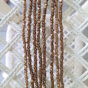 Brass 2.5mm Cornerless Cubes, 1 strand