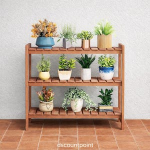 May include: A three-tiered wooden plant stand displaying various potted plants. The plants are in a variety of pots, including blue, white, and gold. The stand is made of brown wood and is placed on a tiled floor.