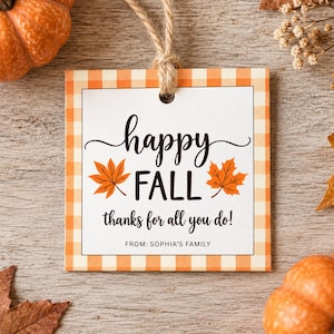 May include: A square gift tag with an orange and white gingham border, featuring the text "happy FALL" in black script and print, two orange maple leaves, and the text "thanks for all you do! FROM: SOPHIA'S FAMILY" with a jute twine loop.