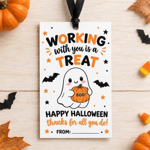 May include: A rectangular white gift tag with a black ribbon loop. The text reads: WORKING with you is a TREAT, HAPPY HALLOWEEN, thanks for all you do!, FROM:. A cartoon ghost holds an orange pumpkin with BOO! written on it, surrounded by black bats and orange stars.