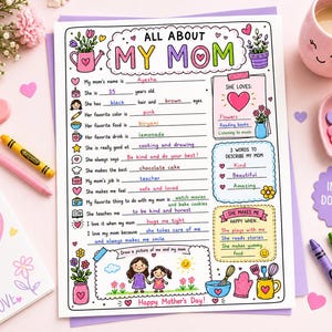 Pode incluir: Uma folha imprimível colorida "Tudo sobre a minha mãe" com seções para preencher, flores e corações. Inclui o texto "Feliz Dia das Mães!" e "Download instantâneo". Lápis de cor e uma caneca também são visíveis.