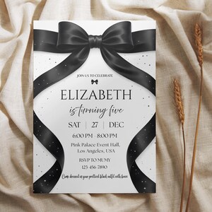 May include: A white invitation card with a large black bow and ribbon design. The text reads "ELIZABETH is turning five" with event details. The card is decorated with small white stars and the text "Come dressed in your prettiest black outfit with bows."