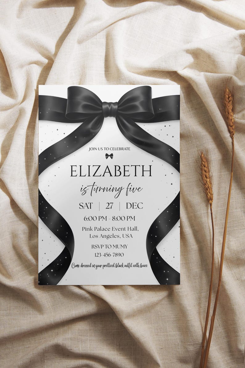 May include: A white invitation card with a large black bow and ribbon design. The text reads "ELIZABETH is turning five" with event details. The card is decorated with small white stars and the text "Come dressed in your prettiest black outfit with bows."