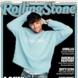 May include: Rolling Stone magazine cover featuring Louis Tomlinson in a light blue sweater and jeans. The magazine title is in a stylized font, with additional text including "Making Lemonade" and article titles like "Gorillaz" and "Bohemian Rhapsody."