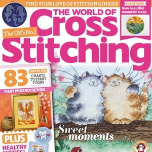 May include: The cover of "The World of Cross Stitching" magazine features a large pink title and images of cross-stitch projects. The cover includes a cross-stitched image of two cats, the text "Sweet moments", and other cross-stitch patterns.