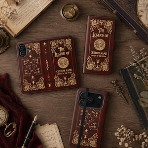 May include: A collection of brown leather phone cases with gold floral and text details. The text reads "THE LEGEND OF" and "CUSTOM NAME CHOSEN OF THE STARS". The cases are designed to look like antique books.
