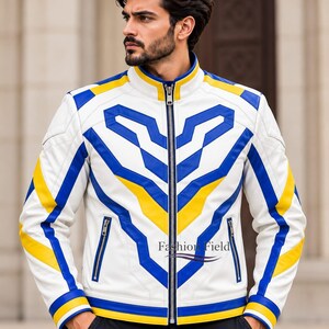 May include: A white leather jacket featuring a bold geometric pattern in royal blue and bright yellow. The jacket has a stand-up collar, a full-length silver metal zipper, and two zippered side pockets. The text Fashion Field is printed on the chest.