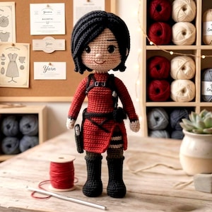 May include: A handcrafted crochet doll with black hair and a red outfit, including a skirt, boots, and a utility belt. The doll is positioned in front of a corkboard with yarn-related labels and a shelf filled with yarn skeins. A spool of red yarn and a crochet hook are in the foreground.