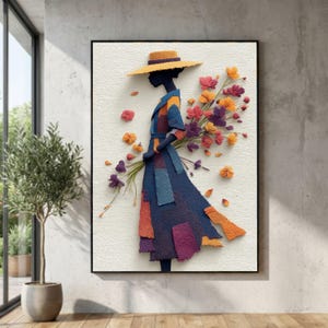 Könnte beinhalten: Ein gerahmtes Kunstwerk zeigt die Silhouette einer Person in einem Patchwork-Kleid und Hut, die einen Strauß bunter Blumen hält. Das Kleid hat blaue, orangefarbene und violette Flicken. Die Blumen sind in Orange-, Rot- und Lilatönen gehalten.
