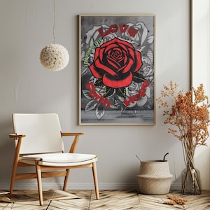May include: A framed art print with a large red rose and the word "LOVE" in red above it. The words "1 Corinthians 13:13" are in green, and "Faith Hope" is in red. The background is grey with white rose outlines.