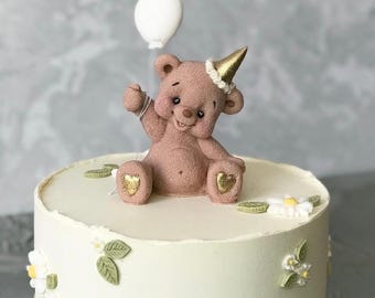 Edible Teddy bear with a balloon cake topper decor for a birthday