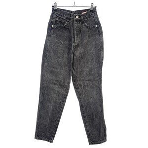May include: High-waisted denim jeans in a washed-out charcoal black color. These pants feature a classic five-pocket design, a metal button closure at the waist, a zipper fly, and visible silver-toned rivets at the corners of the front pockets.