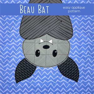 May include: A gray and black applique pattern of a bat with the text "BEAU BAT easy applique pattern" above it. The bat is upside down with its wings spread out. The background is a blue and white chevron pattern.