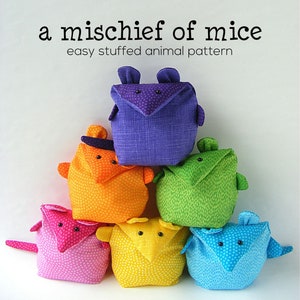 May include: A set of six colorful stuffed mice, each with a different color and pattern. The mice are arranged in a pyramid shape, with the purple mouse on top. The text "a mischief of mice easy stuffed animal pattern" is at the top of the image.