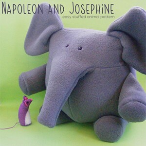 May include: A gray plush elephant toy named Napoleon, with a smaller purple plush mouse toy named Josephine. The elephant has large ears and a long trunk. The mouse has a white belly and pink ears. The toys are on a green background. The text "NAPOLEON AND JOSEPHINE easy stuffed animal pattern" is above the toys. The text "shiny happy world" is below the toys.