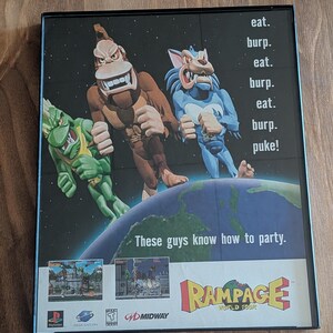 Op de afbeelding: Een videospelhoes voor "Rampage World Tour" met drie cartoonmonsters op een wereldbol. De tekst luidt "eat, burp, puke!" en "These guys know how to party." Het logo van het spel is rood en geel.