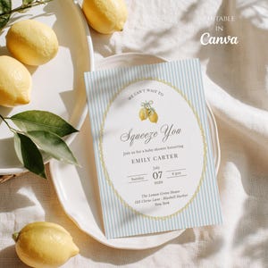 May include: A rectangular baby shower invitation card featuring a light blue and white vertical striped background with a central oval frame. The text reads: We can't wait to Squeeze You, Emily Carter, July 07, 2029, The Lemon Grove House.