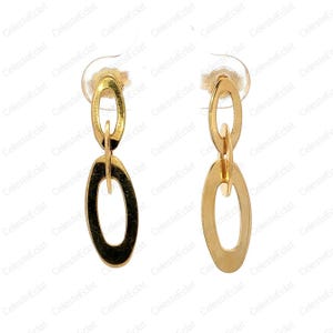 May include: A pair of gold-colored dangle earrings. Each earring features three connected oval shapes, with the largest oval at the bottom. The earrings have a polished finish and are displayed against a white background.