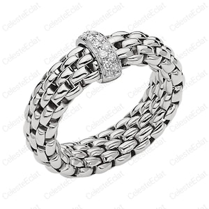 May include: A silver ring with a woven band design. The ring features a small section adorned with multiple small, clear gemstones. The ring is made of a shiny, metallic material.