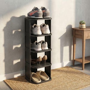 May include: A black, five-tier shoe rack filled with various footwear. The top shelf holds gray and orange sneakers. Other shelves display white sneakers, brown heels, and beige slides. The rack sits on a woven rug.