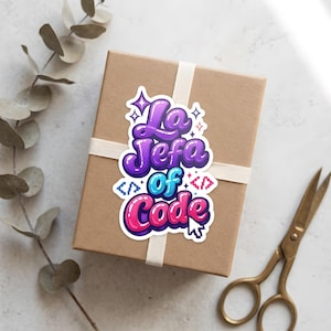 May include: A die-cut sticker featuring the text La Jefa of Code in a glossy, bubble-letter style with purple, blue, and pink gradients. The design includes small star icons, coding bracket symbols, and a computer mouse cursor icon.